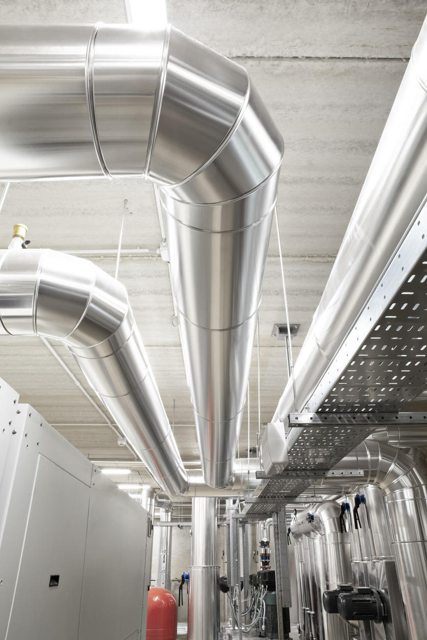 HVAC system pipes, handling heating, ventilation, air conditioning, and cooling, are located on the ceiling. This climate control system ensures the comfort of the rooms in the building.