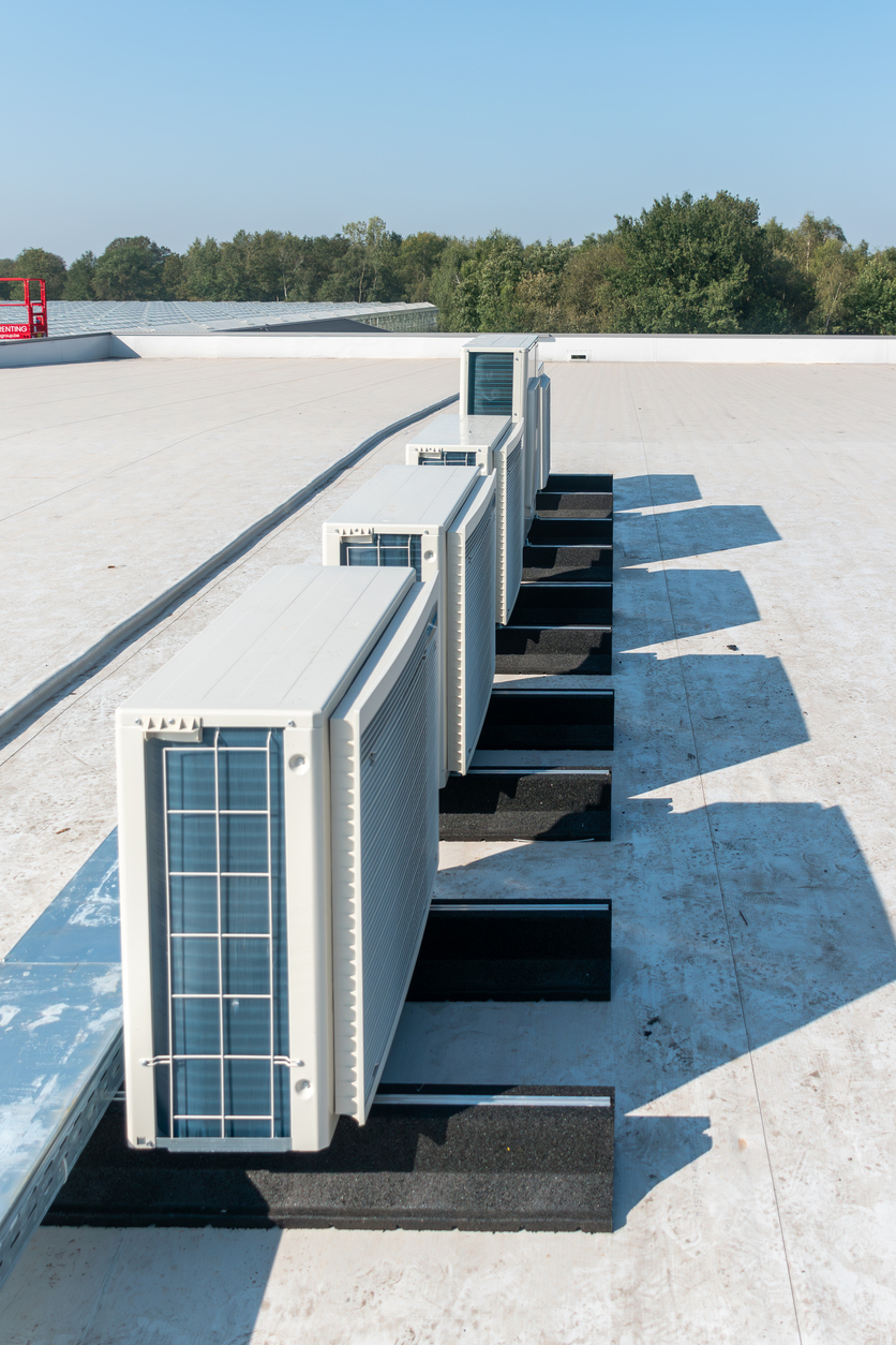 Airco with heat pump, Air compressor on the roof of a building, Air conditioning installed on the roof of a tall building, Air conditioning, heat pump,